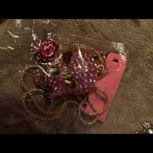 Betsy Johnson pink skull with Rose in it’s mouth